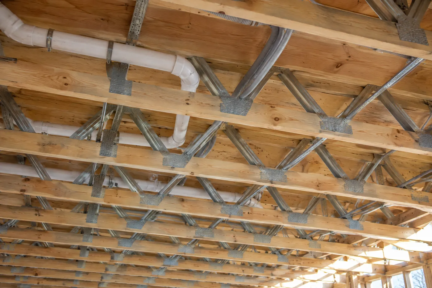 Open-web floor trusses with services running through